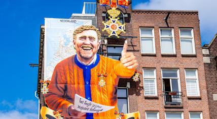 Amsterdam Cafe To Debut Kings Day Mural Featuring Marjolein Faber's Iconic Ribbon Gate Amsterdam Cafe To Debut Kings Day Mural Featuring Marjolein Faber's Iconic Ribbon Gate