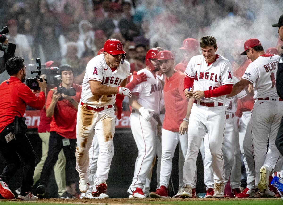 Angels Defeat White Sox In Rain-Shortened Game Thanks To Pari's Walk-Off Homer Angels Defeat White Sox In Rain-Shortened Game Thanks To Pari's Walk-Off Homer