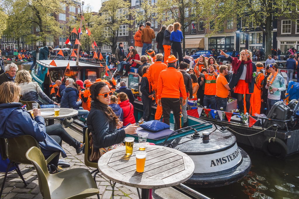 Kings Day In Amsterdam: Cafe Showcases New Mural Referencing Marjolein Faber's Ribbon Gate Kings Day In Amsterdam: Cafe Showcases New Mural Referencing Marjolein Faber's Ribbon Gate